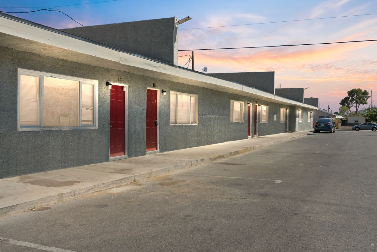 Row of apartment entrances with new doors and lighting